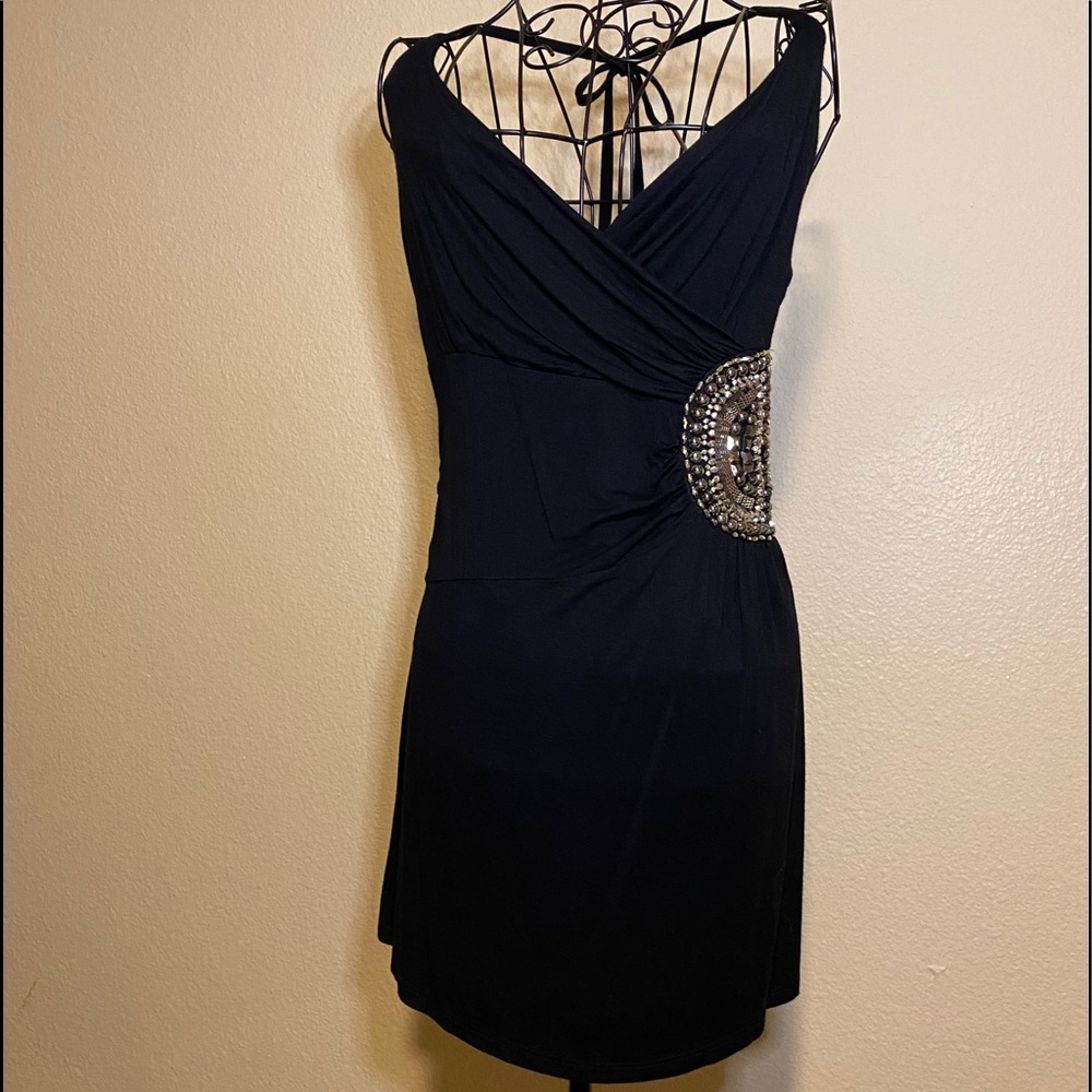 Women’s Black halter dress with embellished side.